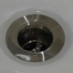 unclog standing water in garbage disposal